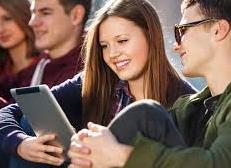 man and woman looking at screen